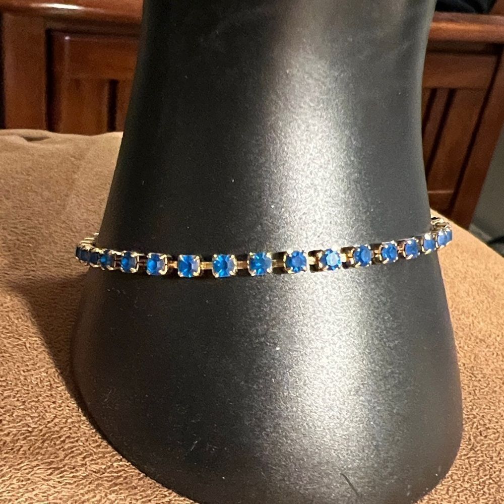 Avon faux sapphire tennis bracelet.